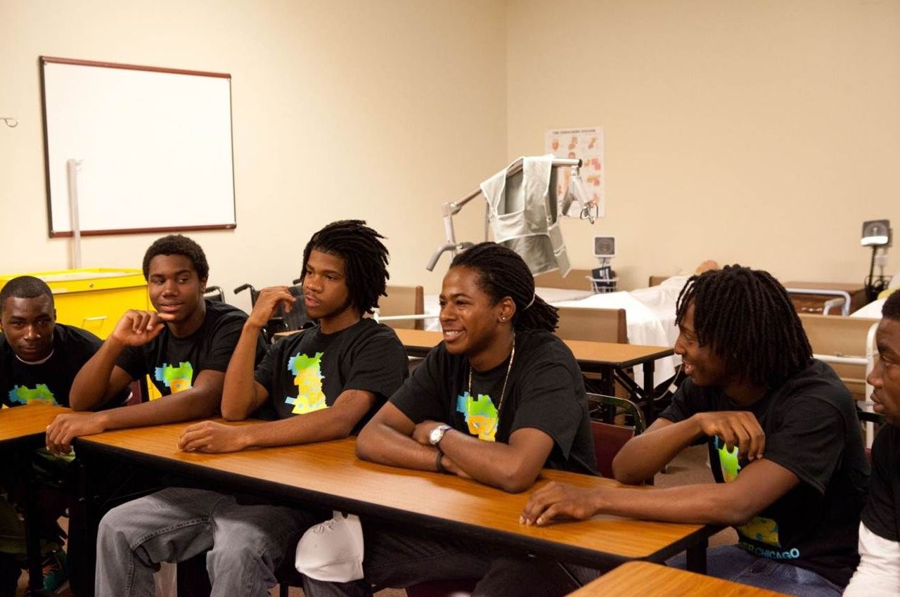 Youth sitting at the table with black tshirts